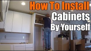 How To Install Upper Kitchen Cabinets By Yourself  THE HANDYMAN [upl. by Noiraa]